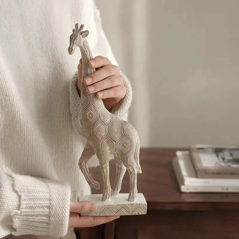 Wood colour giraffe resin ornament on a shelf, showing European style sculptural details.