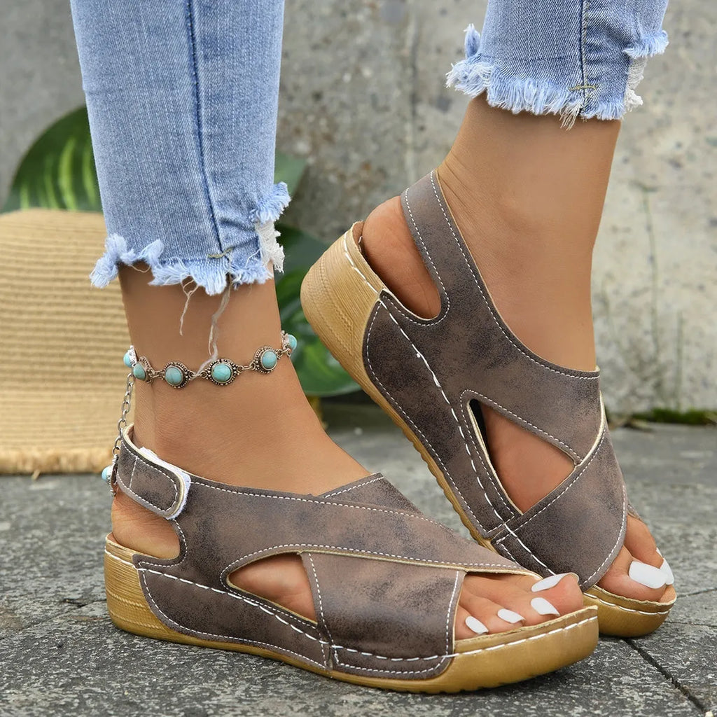 Roman platform sandals with decorative skirt and velcro closure in earth-tone colour