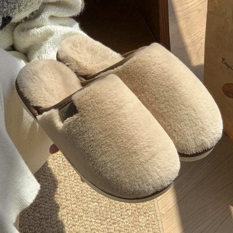 Solid colour PVC winter plush house slippers with car stitching detail on a non-slip sole.
