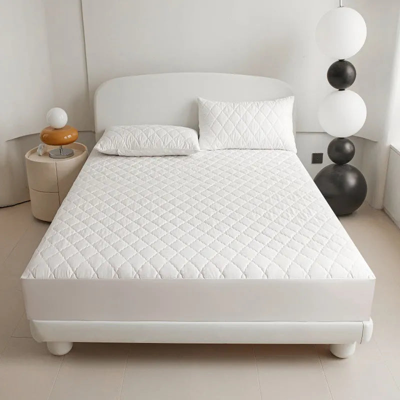 Diamond lattice quilted bamboo fibre mattress protector fitted sheet and pillowcases in solid colour.