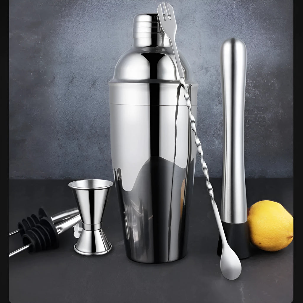 23-piece European style stainless steel cocktail set with shaker, strainer, and bar tools on a table.
