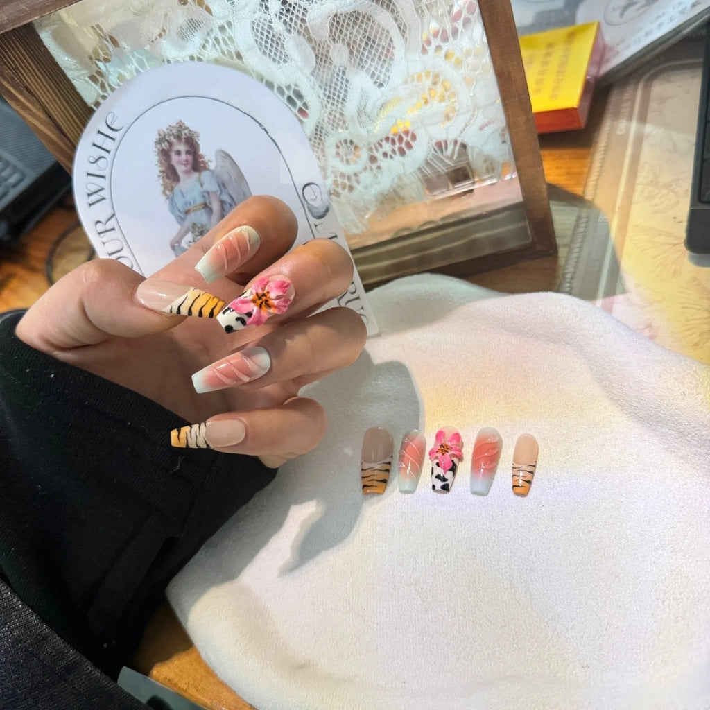 Zebra pattern lily hand carving nail art set showing flower, leopard print, and embossed designs in various sizes.