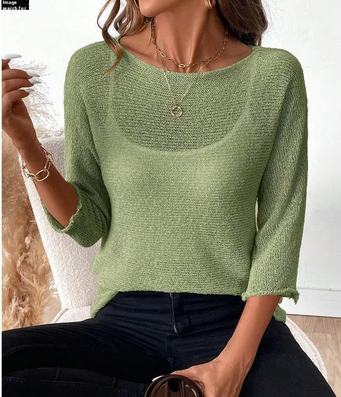 Women's off-shoulder knitted pullover top in lavender purple with a 3D pattern and 3/4 length sleeves.