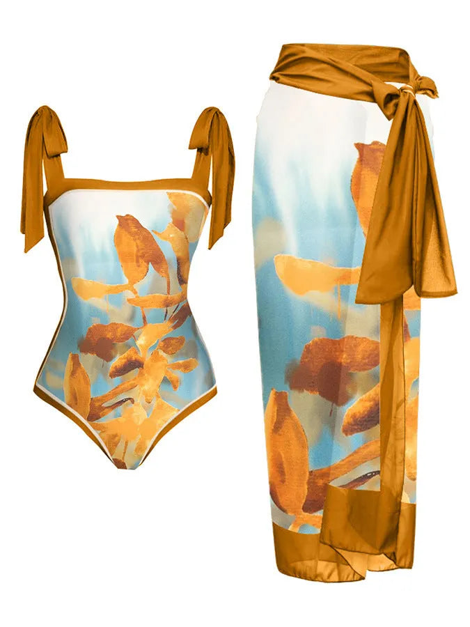 Women's printed floral two-piece swimsuit with a matching chiffon hip skirt.