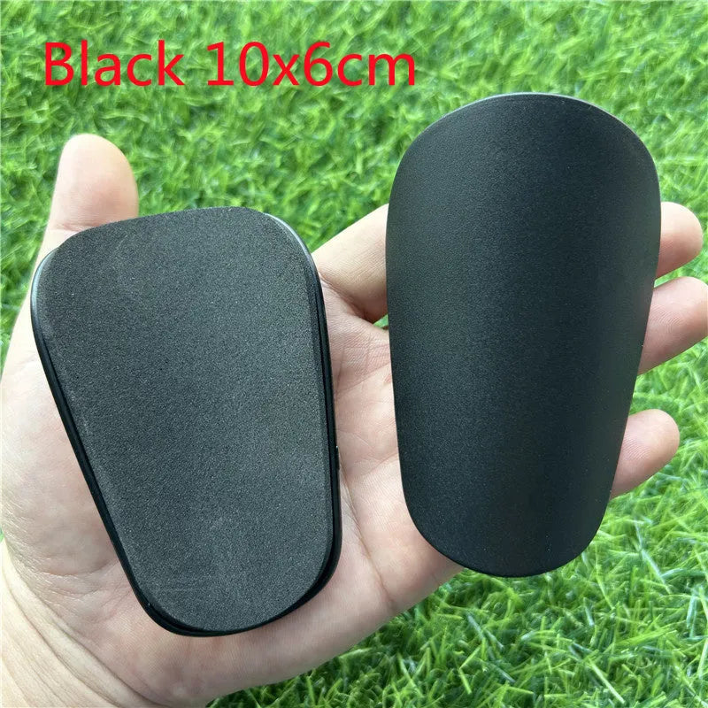 Extra small mini football shin guards plastic protection 8x5 cm black white youth