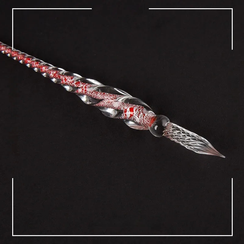 Transparent glass signature pen with coloured ink visible inside, abstract modelling, gift box packaging