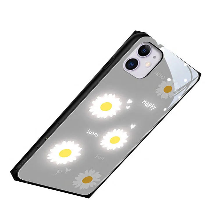 White luminous phone case with painted daisy design for Apple iPhone, showing voice-activated light feature.