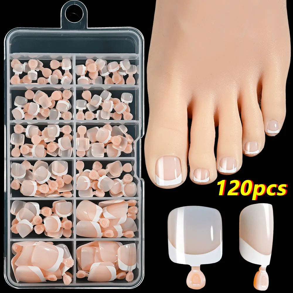 Box of 120 French white edge press-on toe nails in full square short shape showing multiple nude shades.