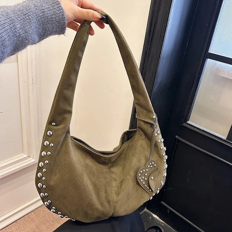 Soft plush retro tote handbag for women in a choice of colours, shown with strapless underarm carry.