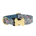 Flat nylon dog collar with grid print and a bone-shaped metal buckle on a white background.