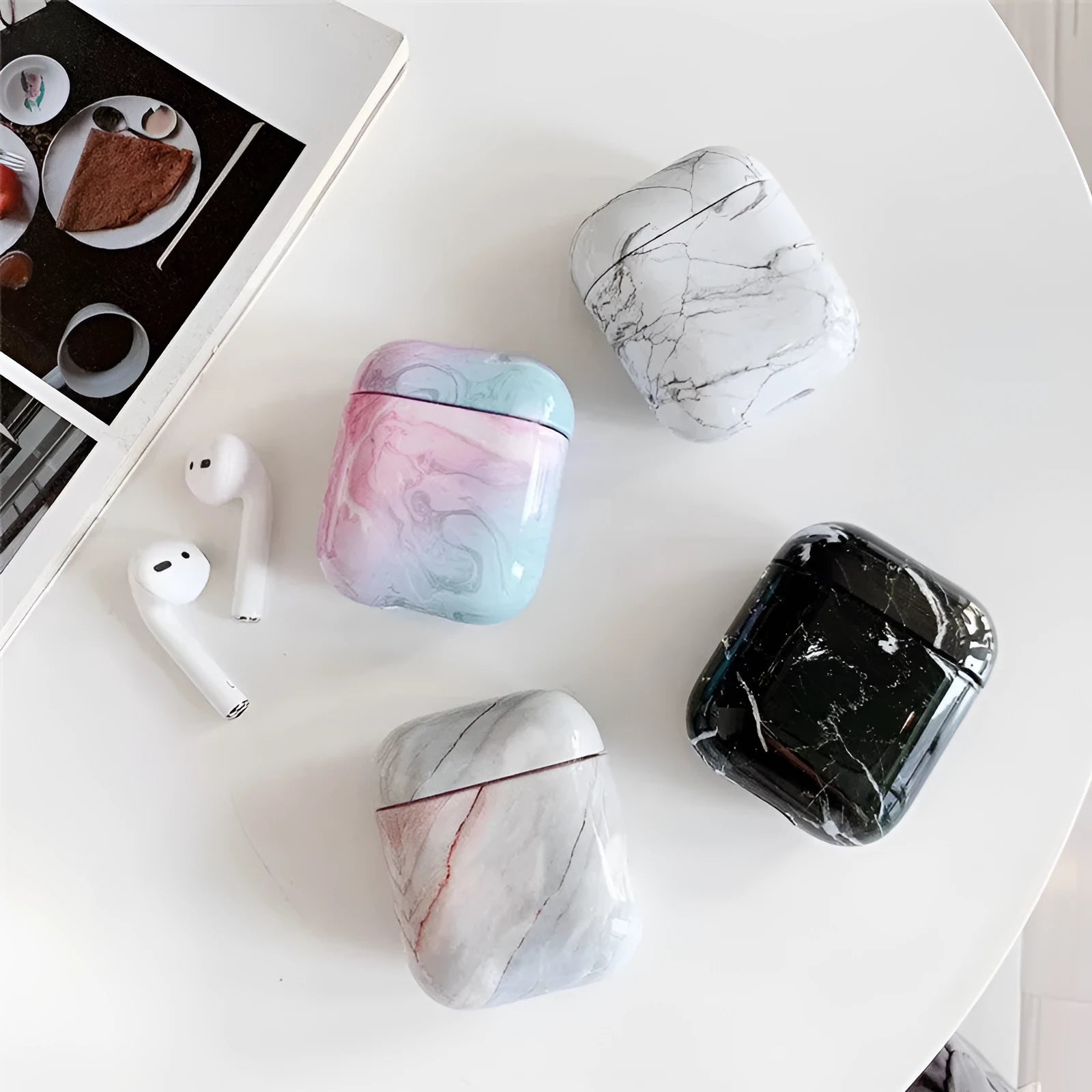 White Marble hard PC protective case fitted on an AirPods wireless charging case.