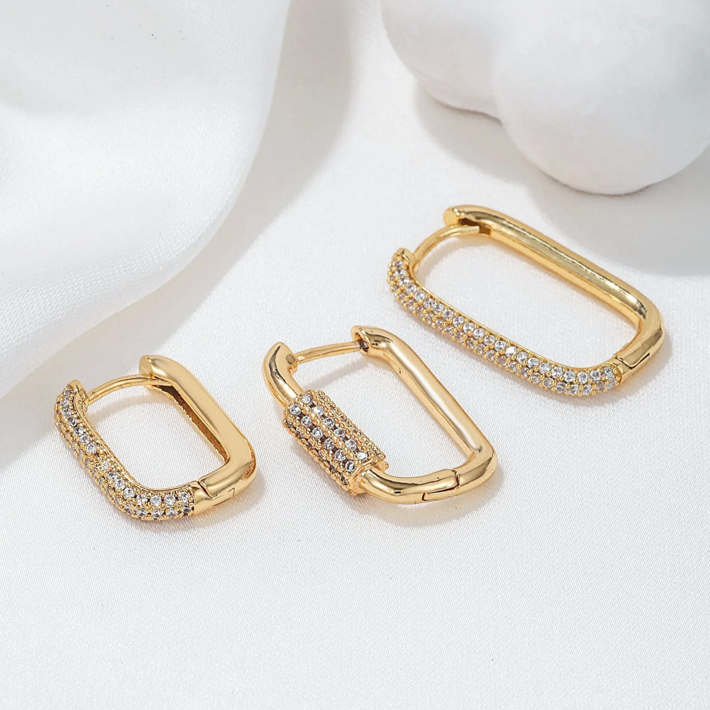 Three geometric copper ear clips with micro inlaid zircon treatment in gold and white colours