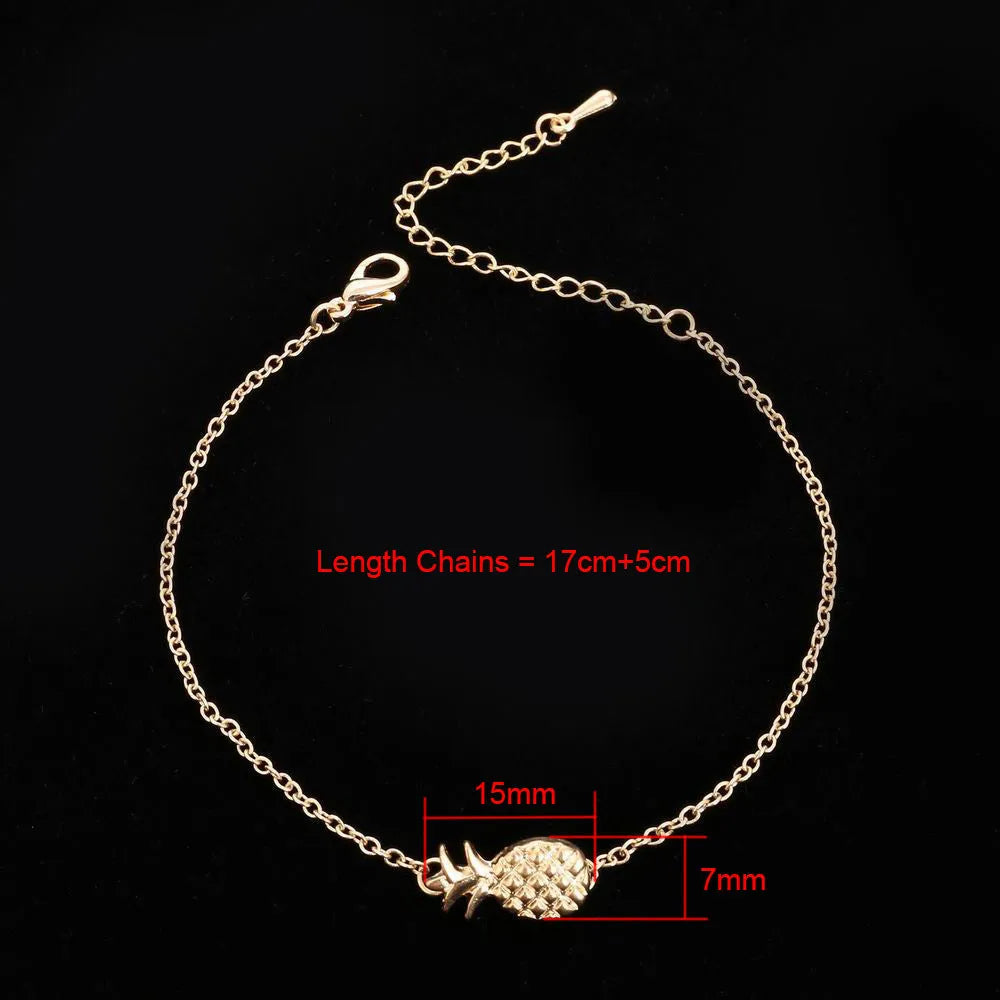 Women's alloy pineapple bracelet on wrist, showing B178 gold or silver finish and fruit-shaped design.