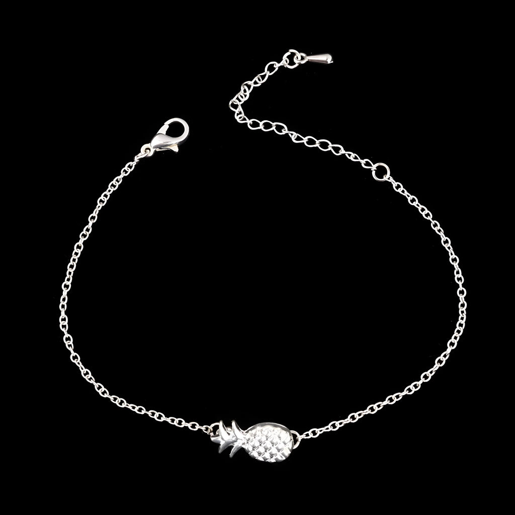 Women's alloy pineapple bracelet on wrist, showing B178 gold or silver finish and fruit-shaped design.