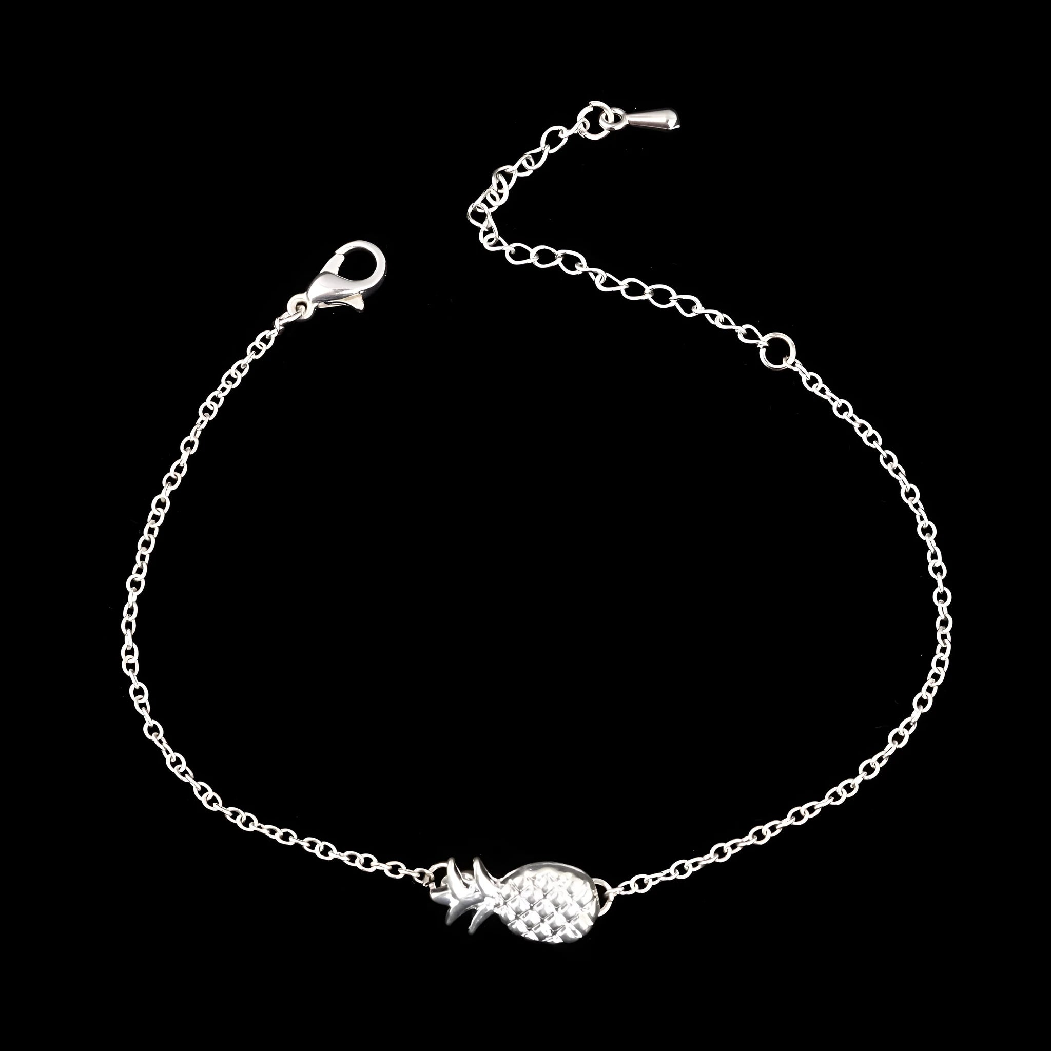 Women's alloy pineapple bracelet on wrist, showing B178 gold or silver finish and fruit-shaped design.