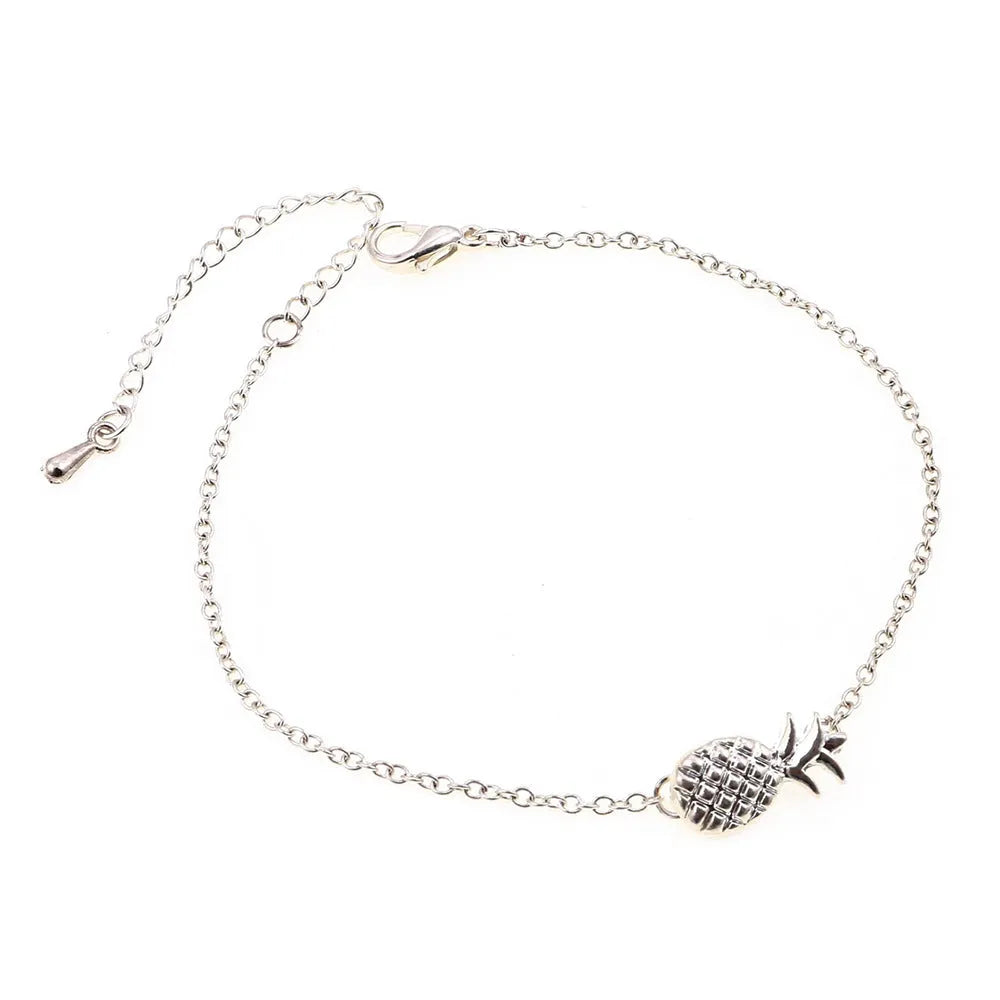 Women's alloy pineapple bracelet on wrist, showing B178 gold or silver finish and fruit-shaped design.