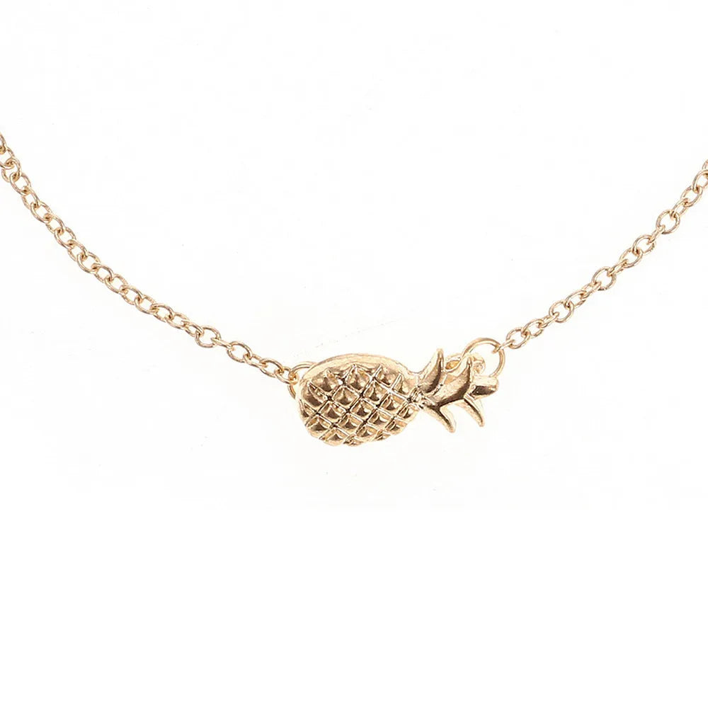 Women's alloy pineapple bracelet on wrist, showing B178 gold or silver finish and fruit-shaped design.