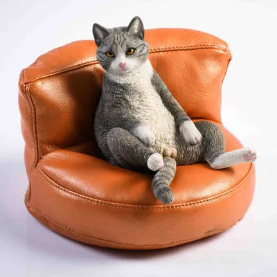 Lazy cat car ornament figure with sofa accessory on dashboard