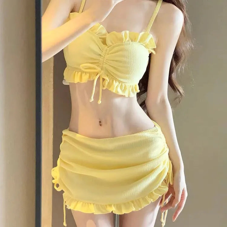 Women's milk silk bikini swimsuit in solid black, pitaya red, or yellow, showing top and pants.