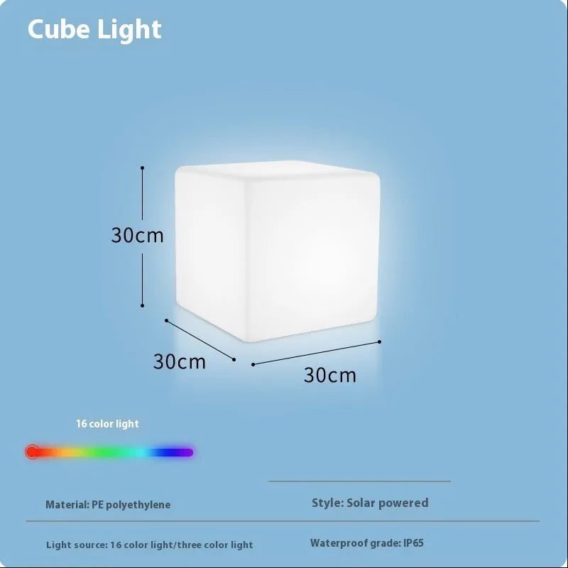 White square LED cube stool light for outdoor use, showing modern design with solar panel or charging port.