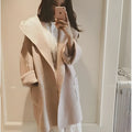 Plus size woman modelling a loose-fit grey cotton coat with lace detail on the sleeves.