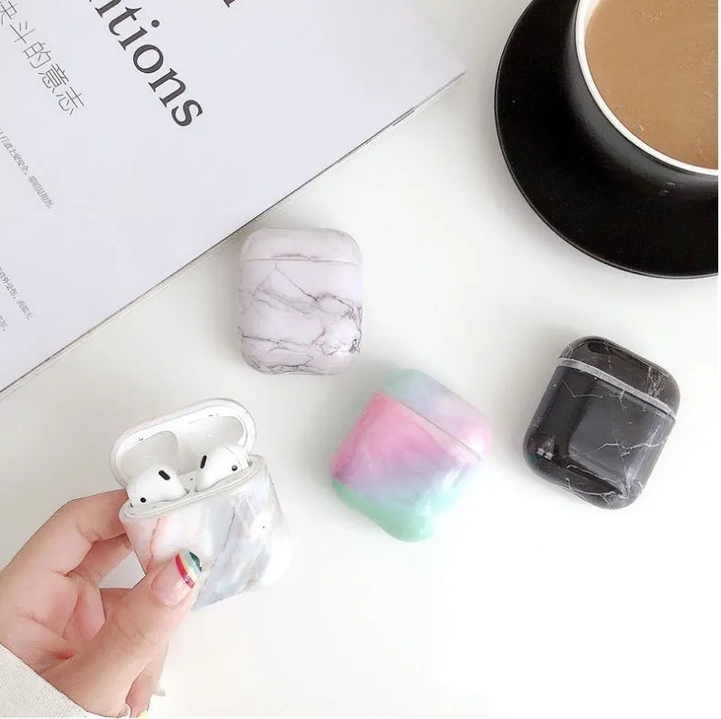 White Marble hard PC protective case fitted on an AirPods wireless charging case.