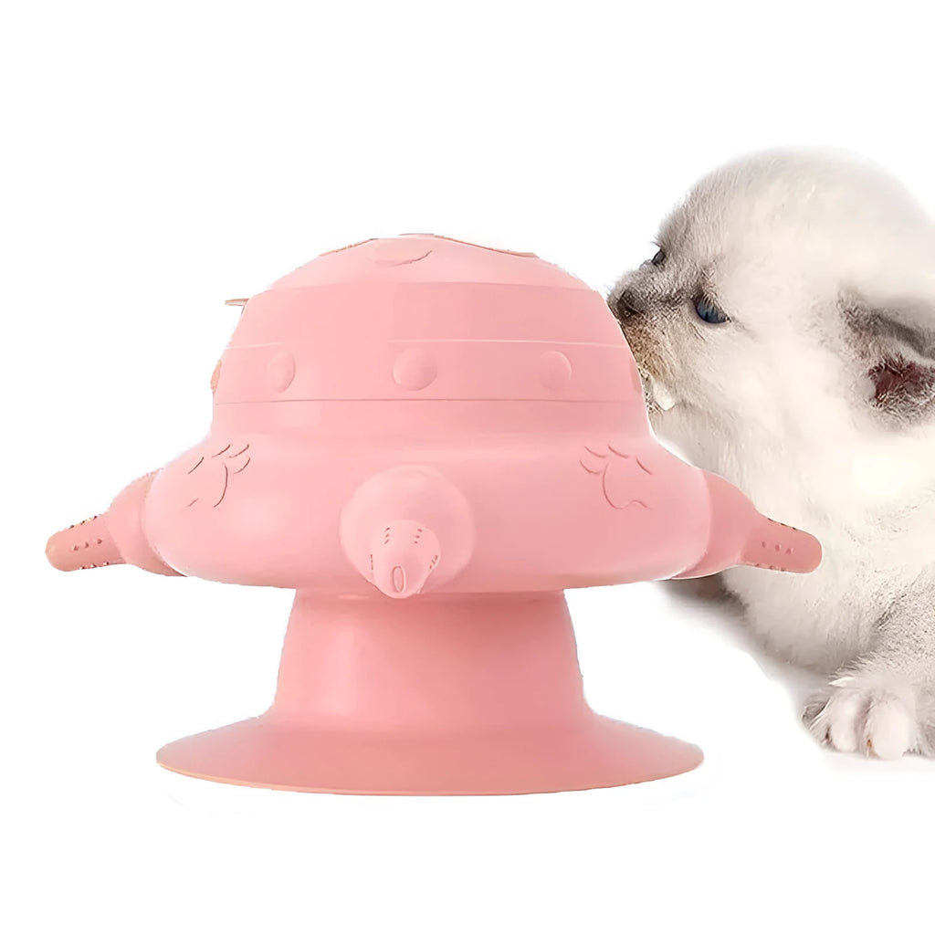 Pink silicone pet nursing device with milk bowl and four pacifiers for puppies and kittens.