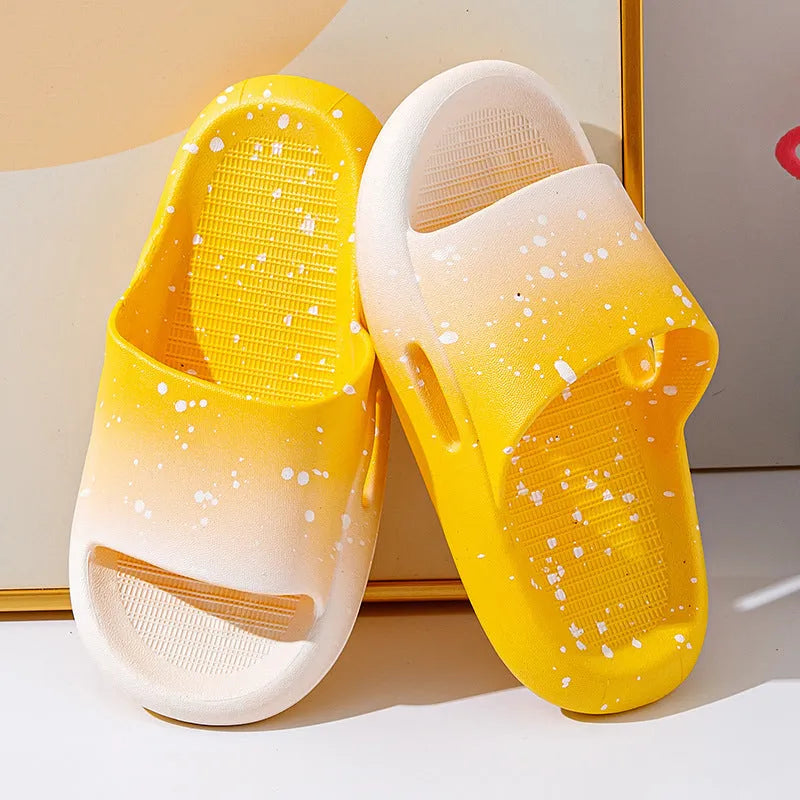 Gradient coloured children's PVC summer slippers with non-slip soles in blue, yellow, green, orange, pink, or black.