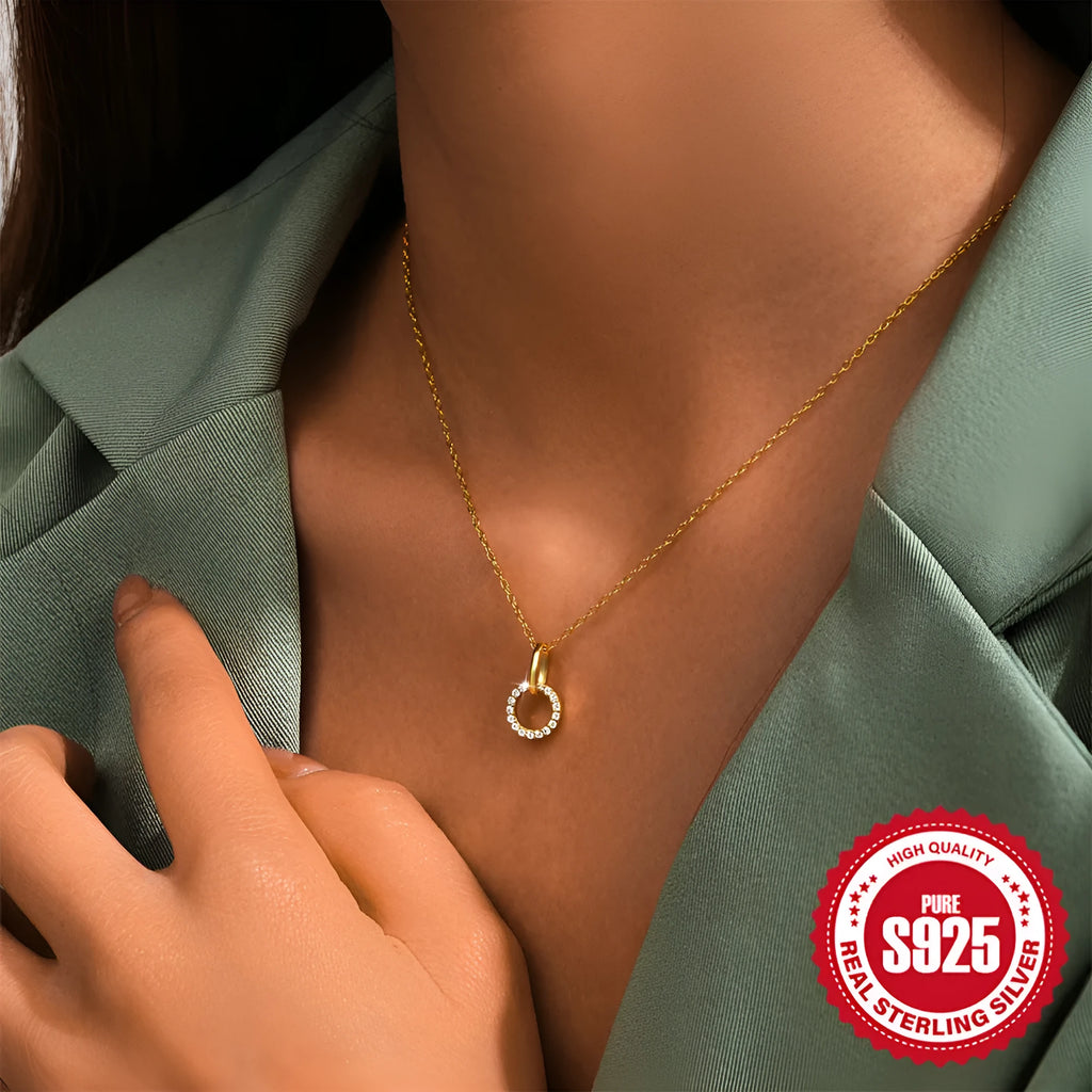 Gold coloured S925 sterling silver adjustable clavicle chain with a geometric round zircon pendant.
