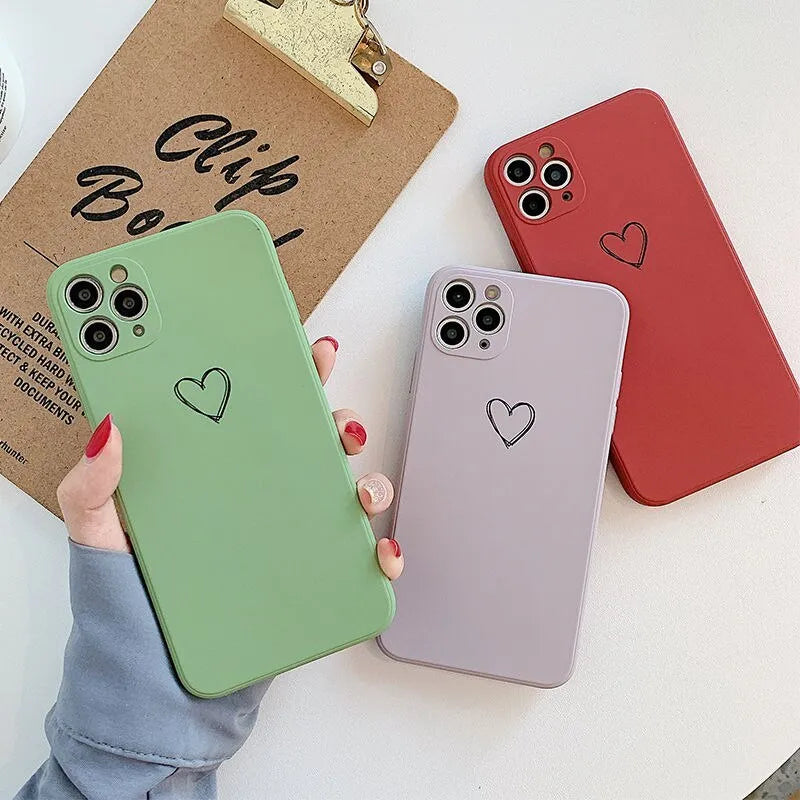 Silicone phone case for Apple iPhones in multiple solid colours including black, white, and pastel options