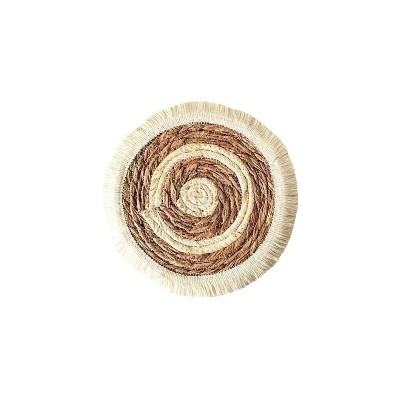 Round papyrus straw placemat with corn rope tassel detailing in modern simplicity style