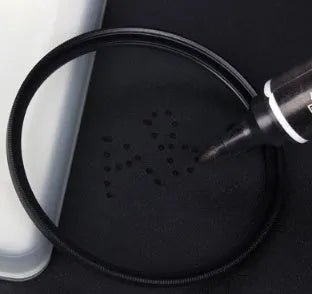 Adjustable camera ND filter kit with four density filters and a set of multi-diameter metal adapter rings.