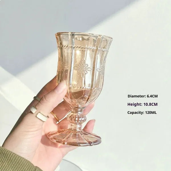 Set of six clear glass drinking vessels with different designs including beer steins and champagne glass