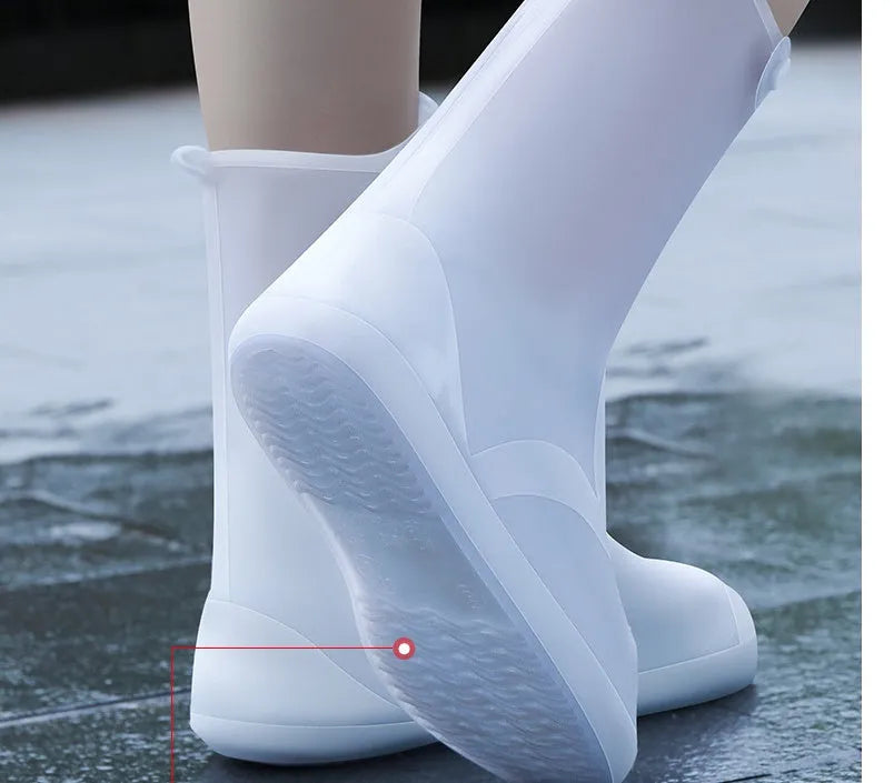 White PVC high top reusable shoe covers for women, shown on a foot, for water resistant protection.