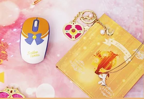 Sailor Moon pink wireless computer mouse with USB receiver showing cartoon character design