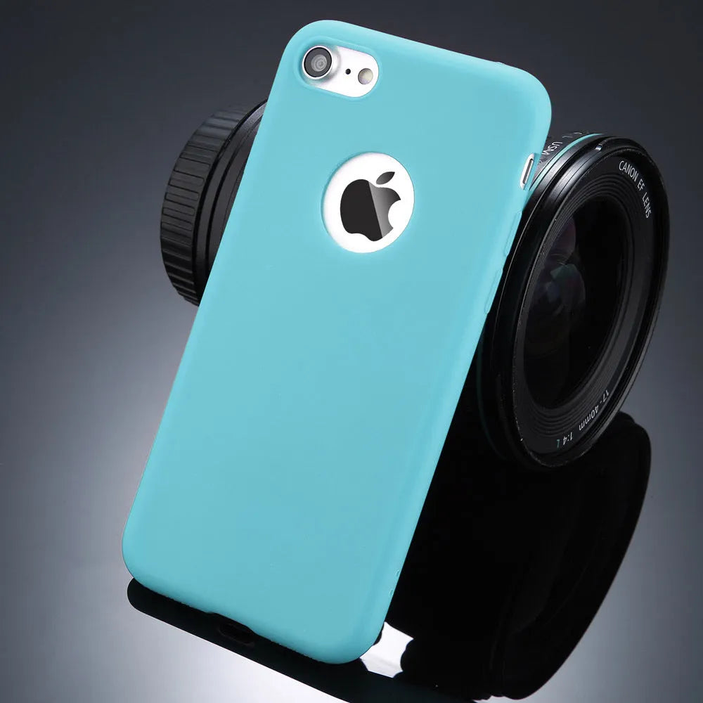 Candy colour soft silicon TPU back cover case for iPhone on a plain background.