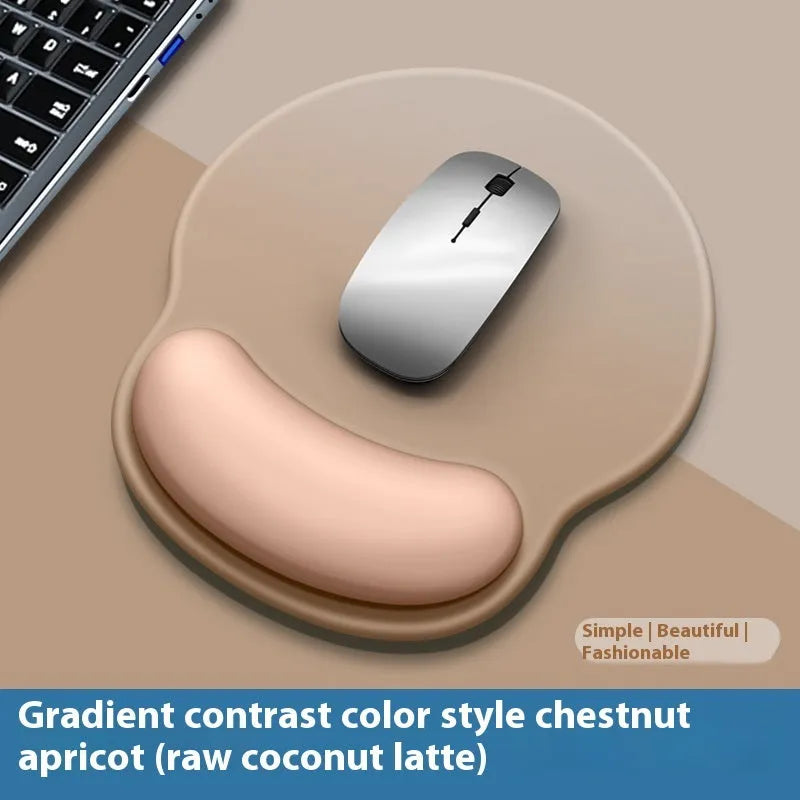 Silicone mouse mat with wrist rest in gradient colour pattern on desk