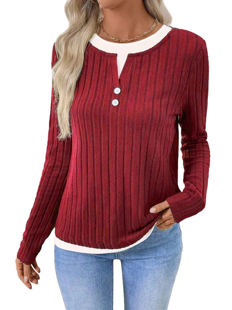 Women's black fake two-piece pullover sweater with round neck and long sleeves.