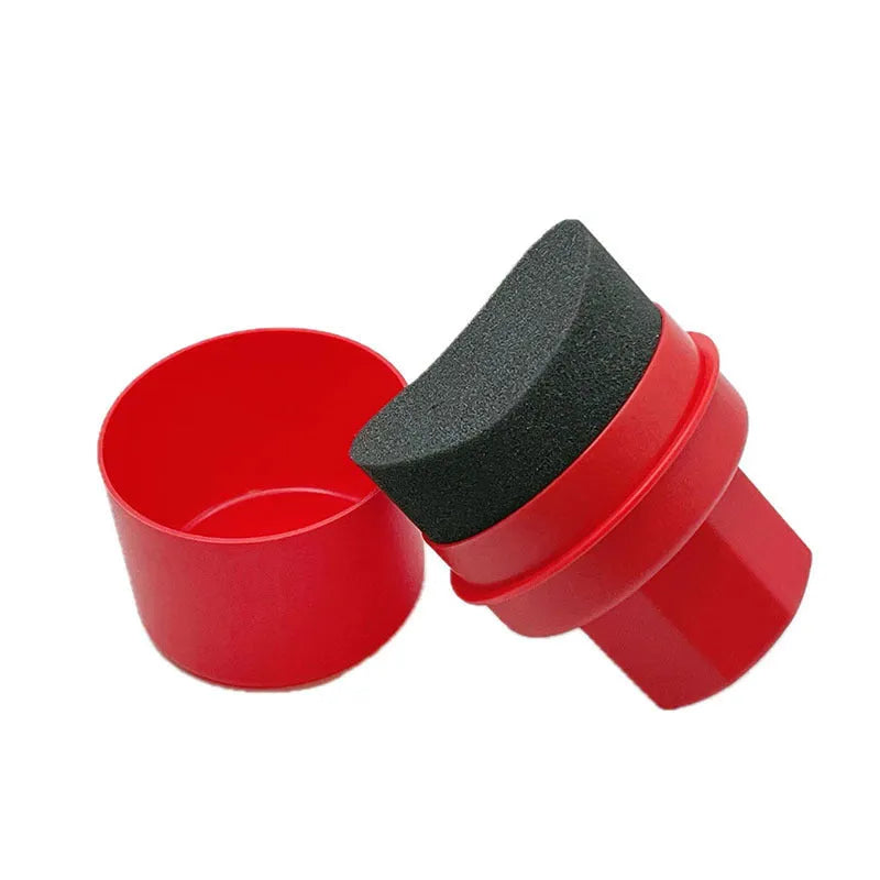 Black and red tyre polishing sponge brushes with lids on a surface, showing hand-held design and sponge options.