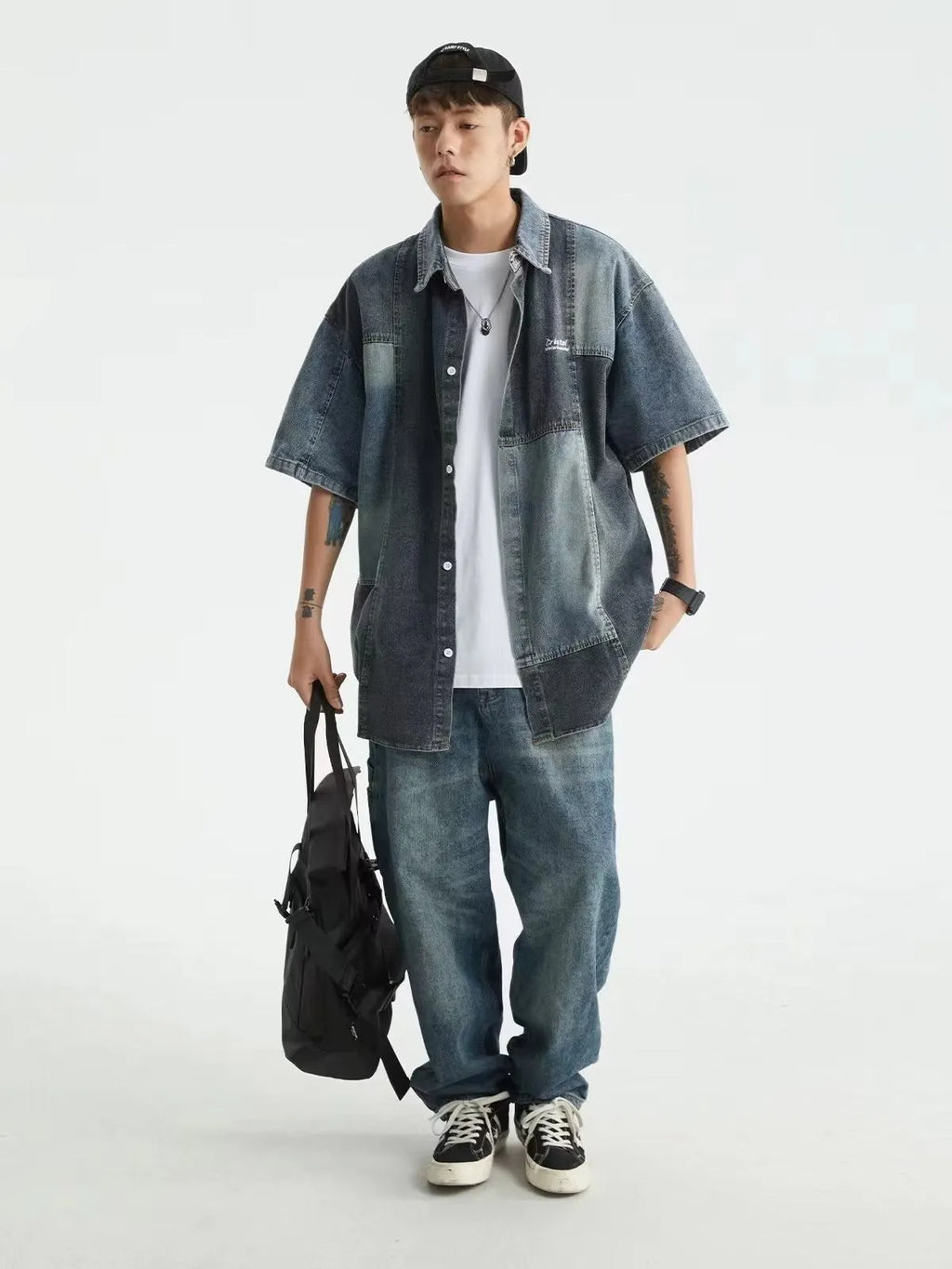 Blue men's denim shirt with washed stitching details and loose cardigan fit