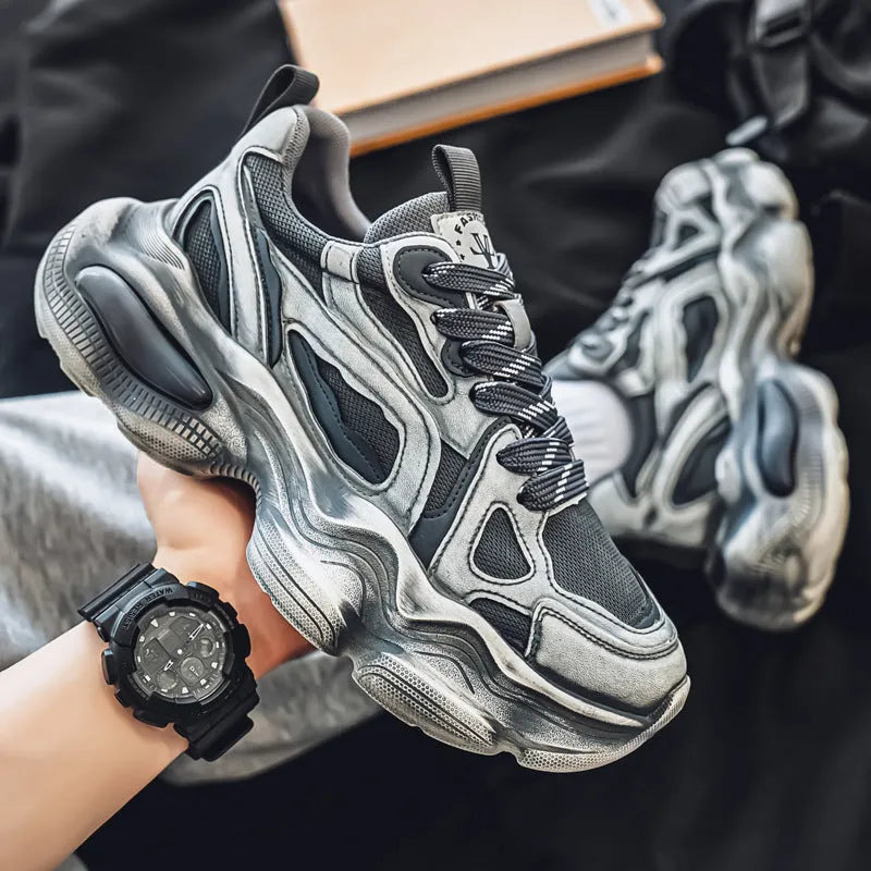 Men's black mesh sneakers with brush colour pattern, platform heel, and lace-up front.