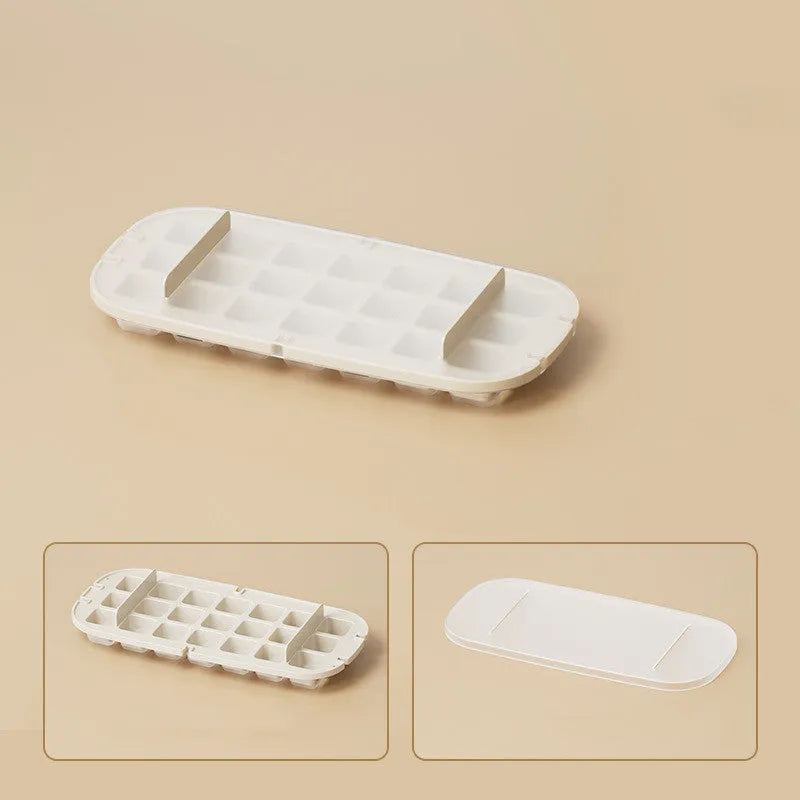 High-capacity ice cube tray in blue with leverage handle and integrated ice shovel storage compartment