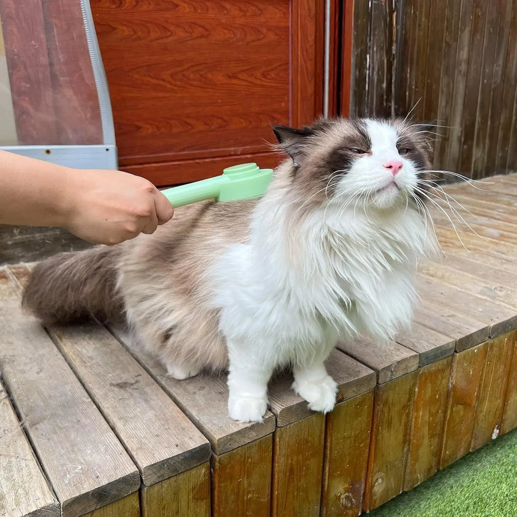 Green and yellow 2-in-1 pet grooming brush with curved teeth for long haired cats and shedding pets