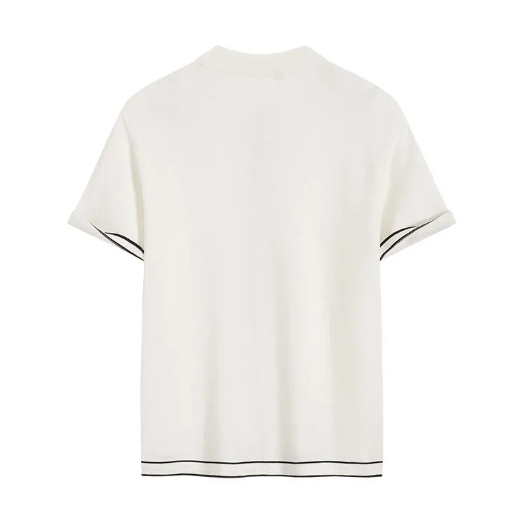 White women's cardigan with dark contrast lapels and short sleeves laid flat