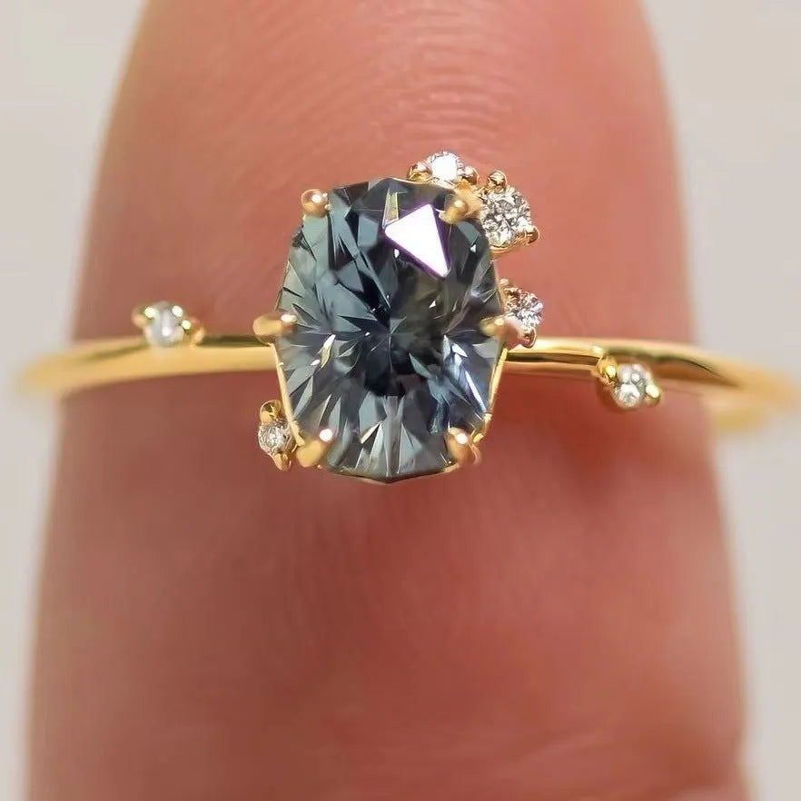 Gold-plated women's ring with green zircon stone in floral design, showing detailed metalwork and stone setting