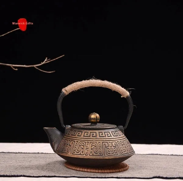Japanese-style cast iron teapot with decorative patterns and 0.9L capacity for brewing tea