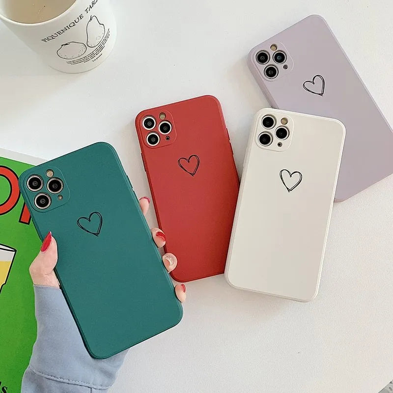 Silicone phone case for Apple iPhones in multiple solid colours including black, white, and pastel options