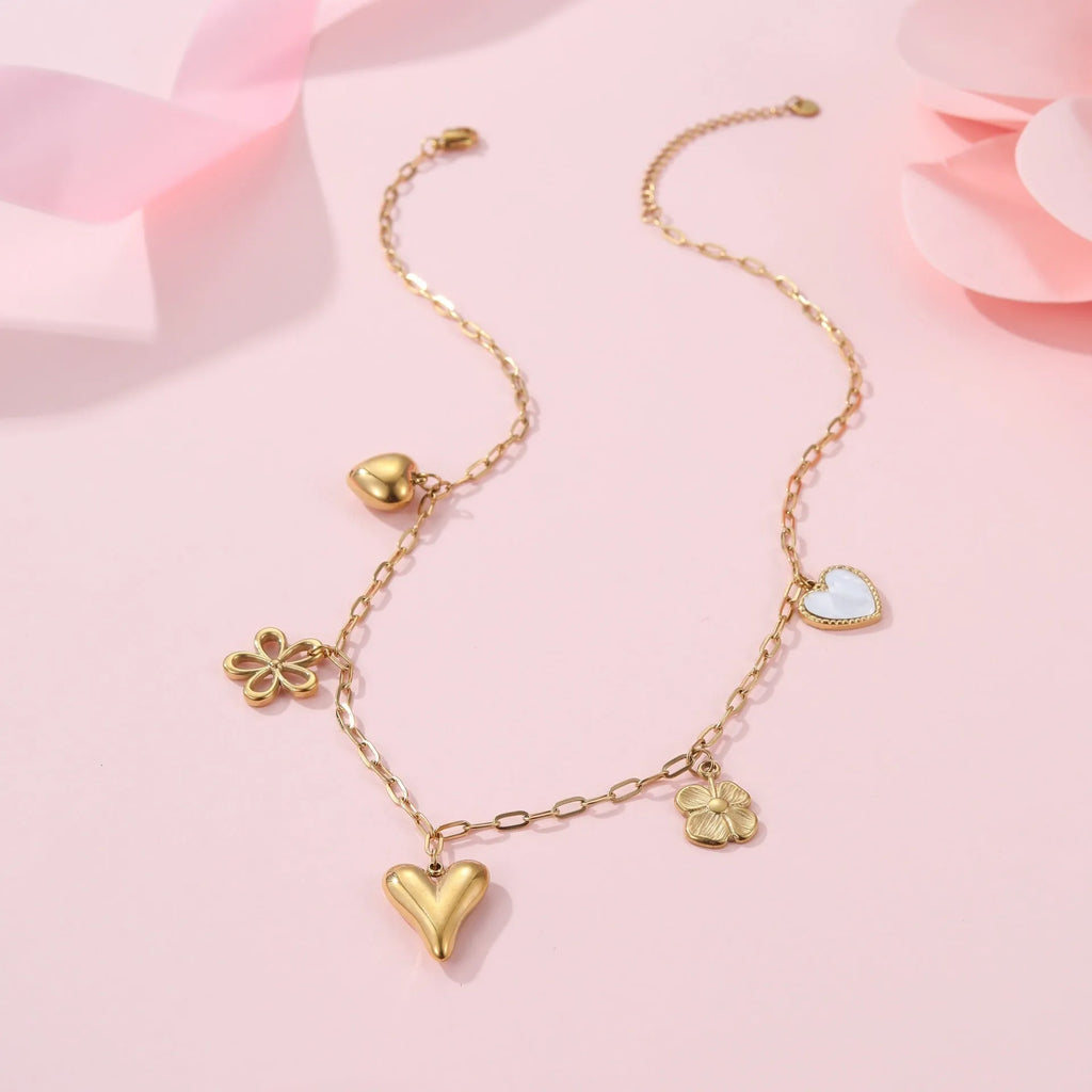 Geometric sun pendant on a stainless steel necklace with an 18K gold electroplated finish.