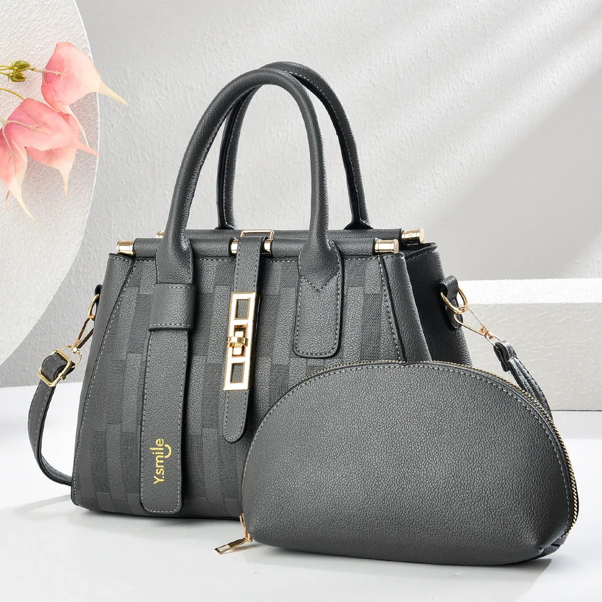 Round black PU leather crossbody bag with adjustable strap on a mannequin, showing zip closure.