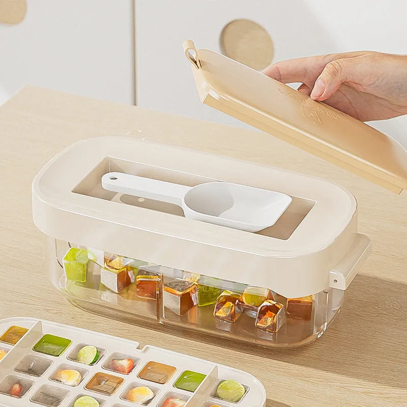 High-capacity ice cube tray in blue with leverage handle and integrated ice shovel storage compartment